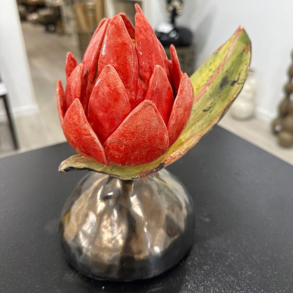Red Protea sculpture by Lisa Hölzl, currently exhibited at Winmark Wines