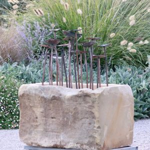 Sculpture "Lilly" in Sculpture "Sandstone Pond" by Michael Ferris