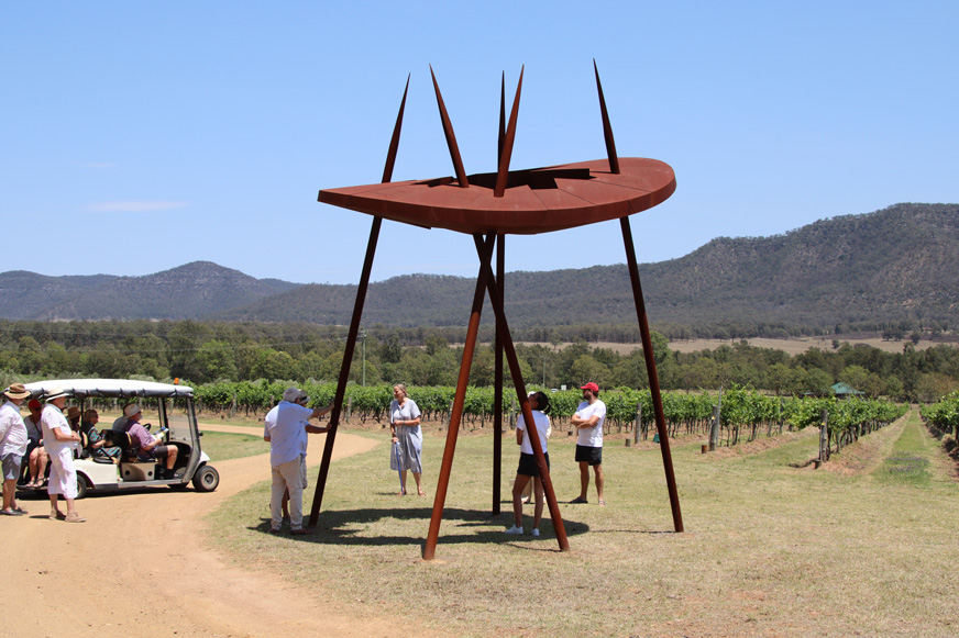 People viewing Celest sculpture at Winmark Wines